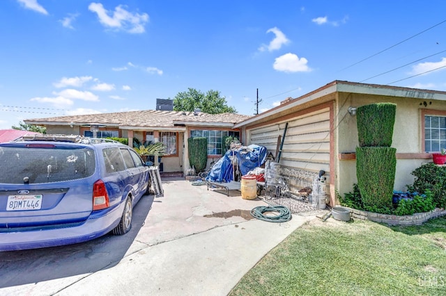 3105 Dore Dr, Bakersfield, CA 93304 - view of front of property with stucco siding and an attached garage