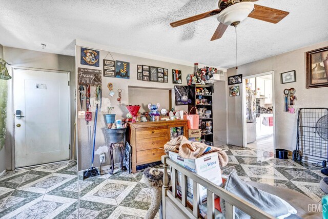 3105 Dore Dr, Bakersfield, CA 93304 - bedroom featuring a textured ceiling and a ceiling fan