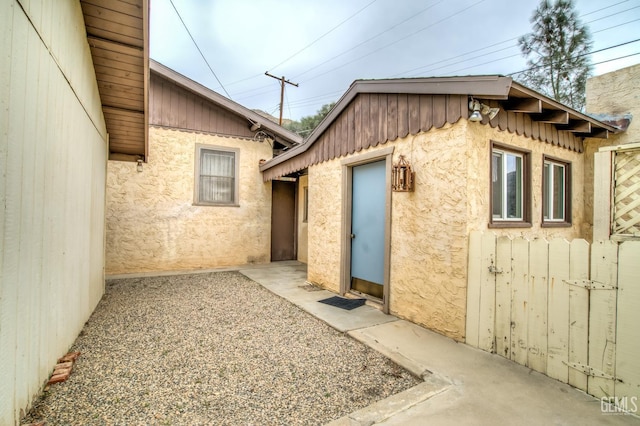 view of side of property with a patio