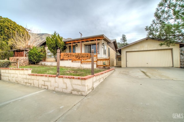 view of front of house featuring a garage and a porch