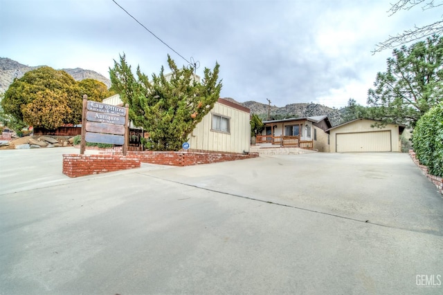 view of front of house with a mountain view and a garage