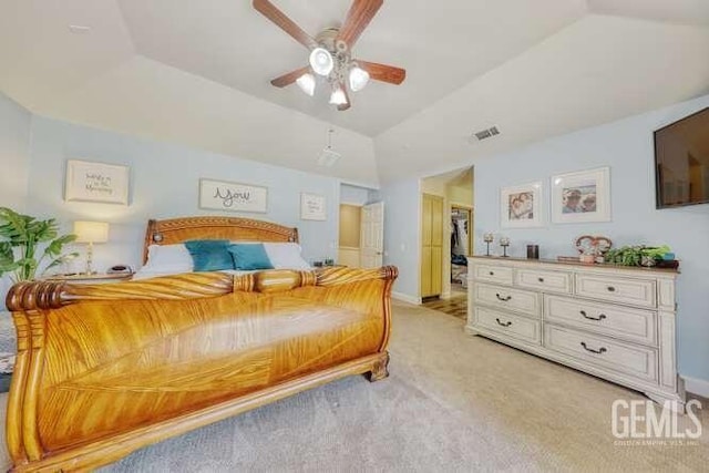 bedroom featuring a closet, vaulted ceiling, ceiling fan, and light colored carpet