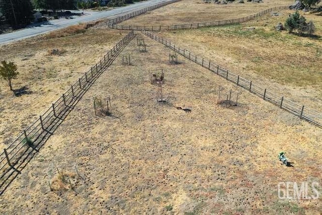 birds eye view of property with a rural view