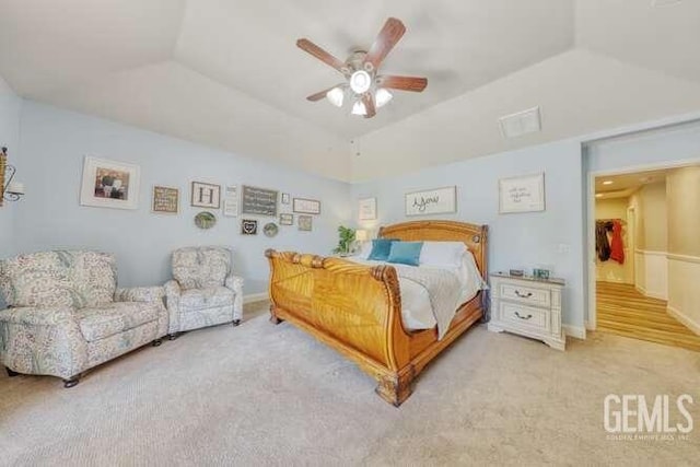 bedroom featuring ceiling fan and lofted ceiling