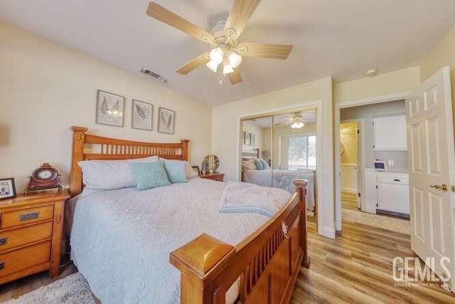 bedroom with ceiling fan, a closet, and light hardwood / wood-style flooring