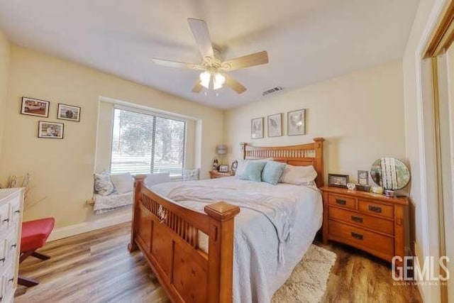 bedroom featuring ceiling fan and light hardwood / wood-style floors