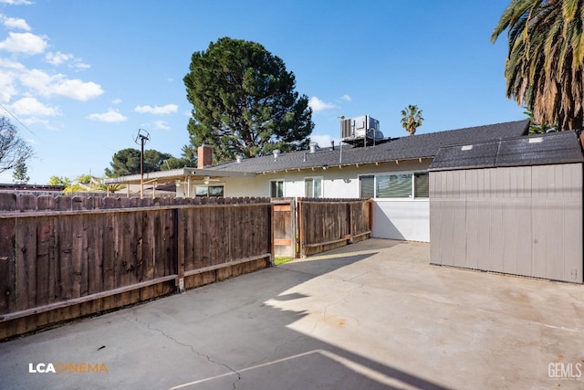 view of patio / terrace featuring cooling unit and fence