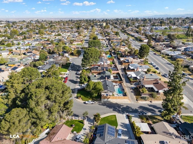 birds eye view of property with a residential view