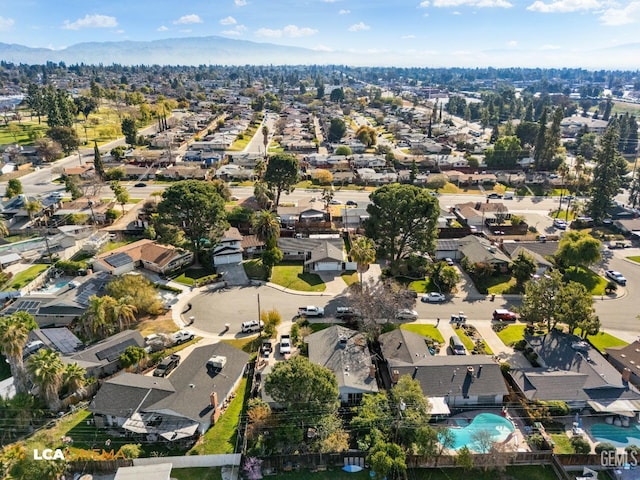 birds eye view of property with a residential view