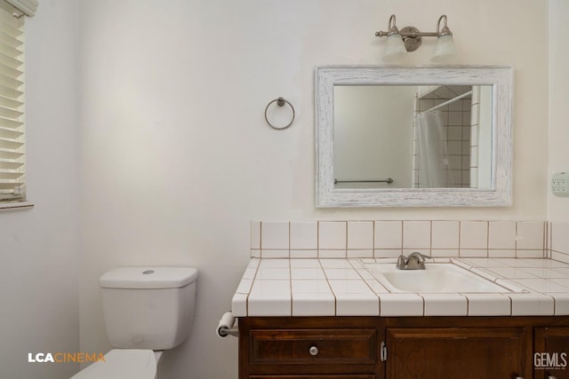 full bath featuring toilet and vanity