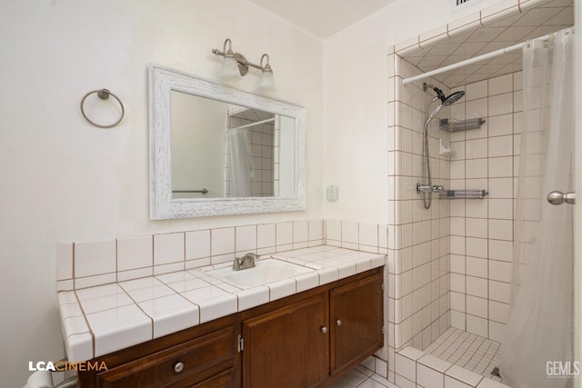 bathroom featuring vanity and a shower stall