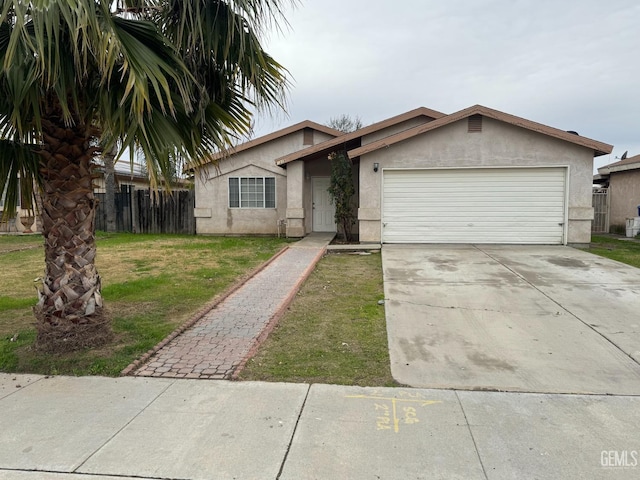 ranch-style home with a garage and a front lawn