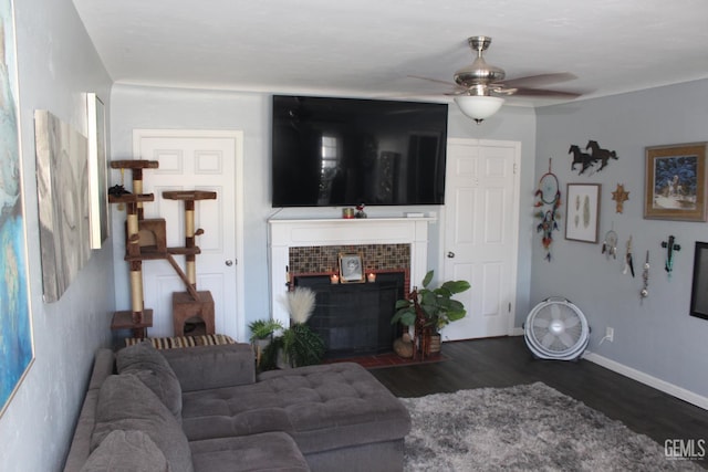 327 Ray St, Bakersfield, CA 93308 - living room with ceiling fan, dark wood-type flooring, and a tile fireplace