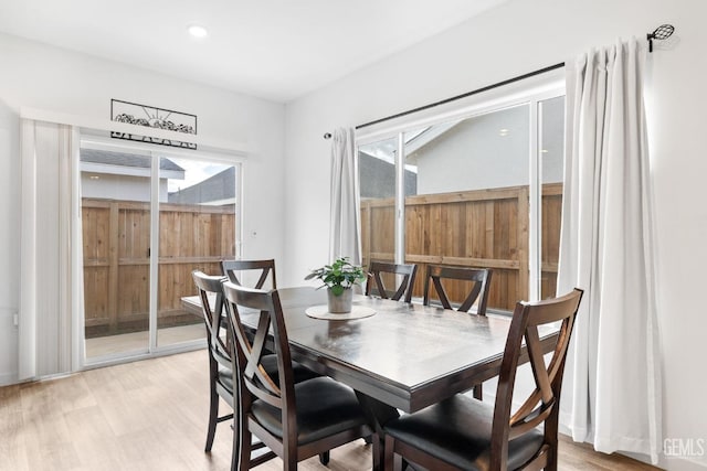 dining space featuring light wood-type flooring