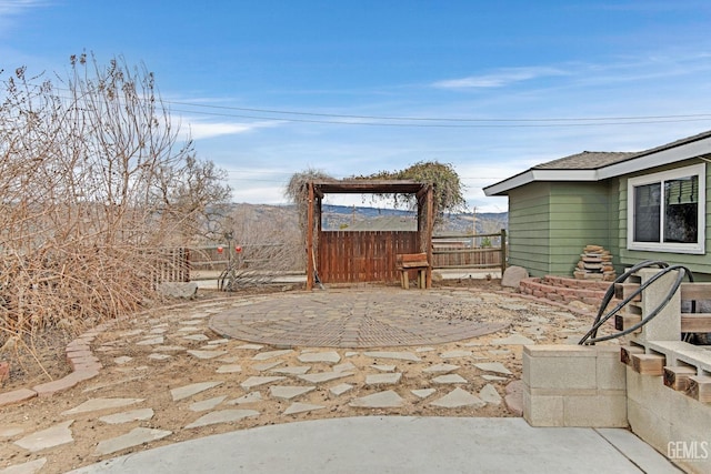 view of patio / terrace featuring a mountain view