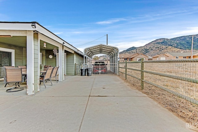 view of patio / terrace featuring a mountain view