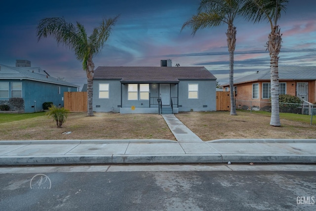 bungalow-style home featuring a yard