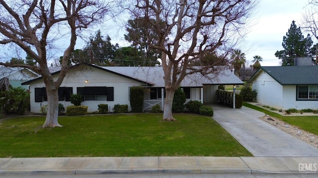 ranch-style house featuring a carport and a front lawn