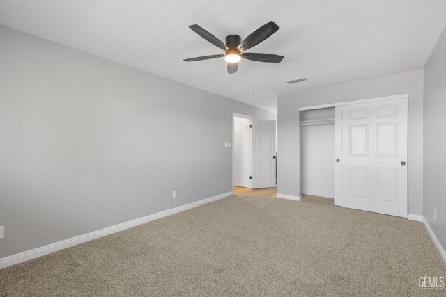 2848 Summit Cir, Bakersfield, CA 93306 - unfurnished bedroom featuring light carpet, a closet, and a ceiling fan