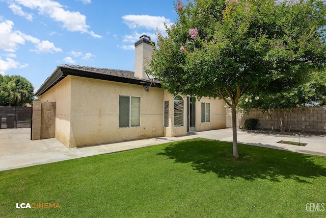 5502 White Pine Way, Bakersfield, CA 93313 - rear view of house with stucco siding, a chimney, and a patio