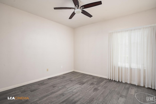 5502 White Pine Way, Bakersfield, CA 93313 - spare room featuring dark wood-style flooring, ceiling fan, and baseboards