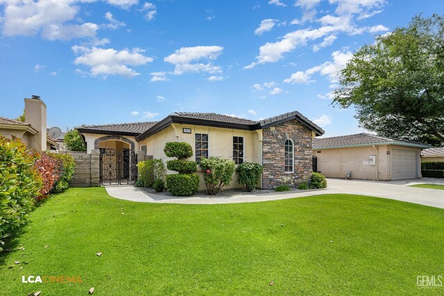 5502 White Pine Way, Bakersfield, CA 93313 - view of front of property with stucco siding, concrete driveway, a tiled roof, stone siding, and a gate
