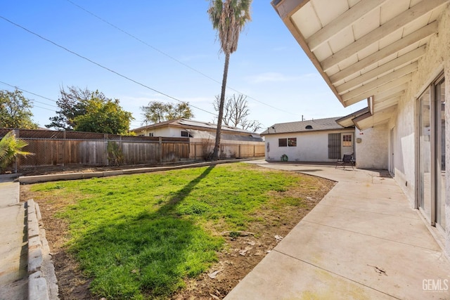 view of yard with a patio area and a fenced backyard