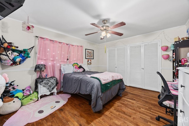 bedroom with wood finished floors and a ceiling fan