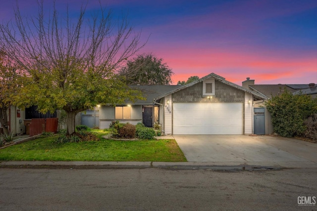 6009 Cedar Glen Ln, Bakersfield, CA 93313 - ranch-style home with an attached garage, concrete driveway, a chimney, and a front lawn