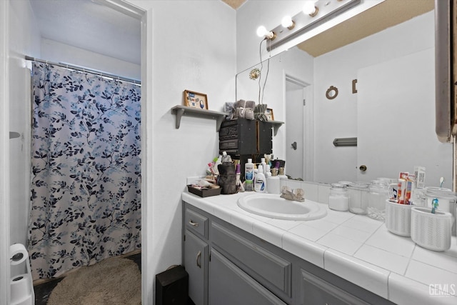 6009 Cedar Glen Ln, Bakersfield, CA 93313 - bathroom featuring vanity and curtained shower