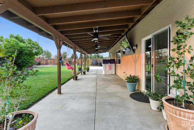 8907 Stevie Ct, Bakersfield, CA 93313 - fenced backyard with a patio and ceiling fan