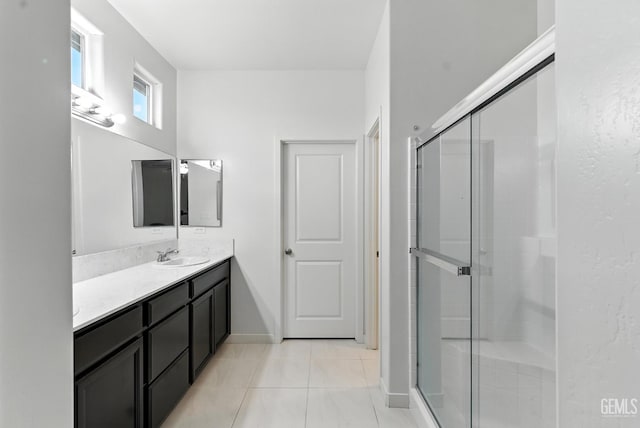 8907 Stevie Ct, Bakersfield, CA 93313 - bathroom featuring vanity, a stall shower, and tile patterned flooring