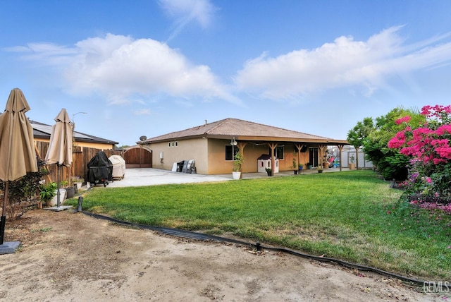 8907 Stevie Ct, Bakersfield, CA 93313 - rear view of property with a fenced backyard, stucco siding, and a patio area