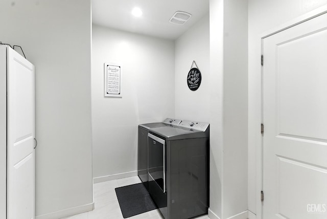 8907 Stevie Ct, Bakersfield, CA 93313 - laundry room with separate washer and dryer and baseboards