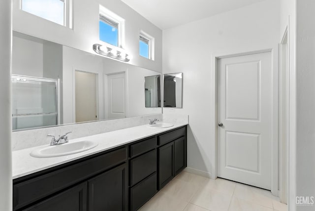 8907 Stevie Ct, Bakersfield, CA 93313 - bathroom featuring double vanity, tile patterned floors, and a stall shower