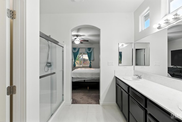 8907 Stevie Ct, Bakersfield, CA 93313 - ensuite bathroom with vanity, a stall shower, a ceiling fan, and tile patterned floors