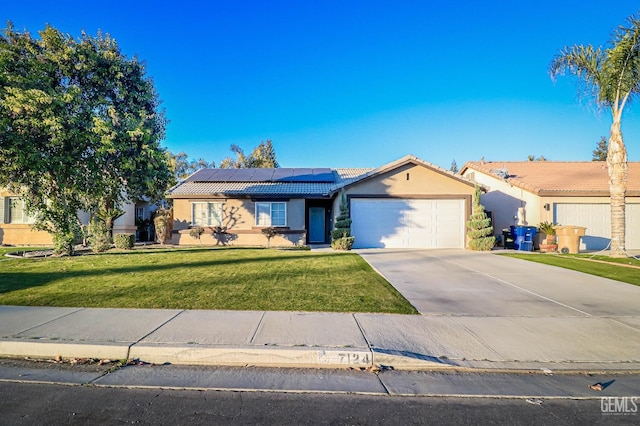 single story home with solar panels, a front lawn, and a garage