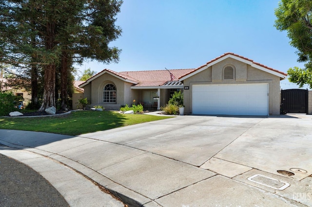 812 Mazatlan Dr, Bakersfield, CA 93314 - single story home featuring stucco siding, a tile roof, a front lawn, and concrete driveway