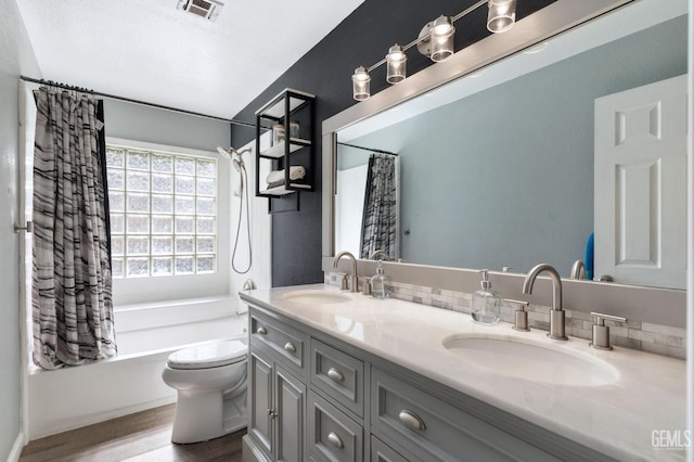812 Mazatlan Dr, Bakersfield, CA 93314 - full bathroom with shower / bathtub combination with curtain, double vanity, and wood finished floors