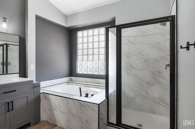 812 Mazatlan Dr, Bakersfield, CA 93314 - full bathroom featuring a marble finish shower, a garden tub, vanity, and wood finished floors