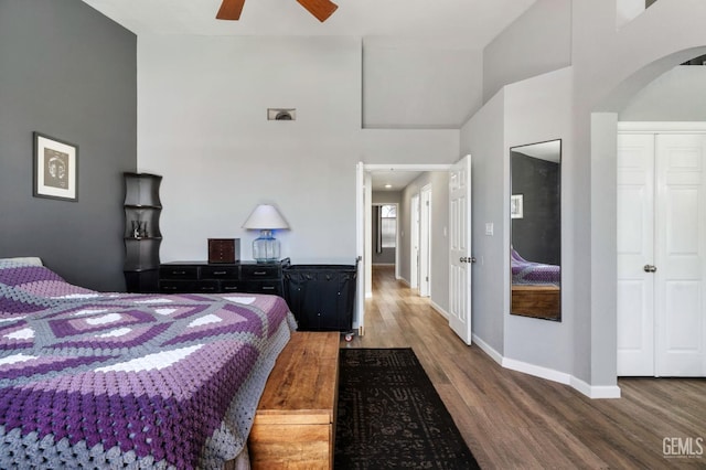 812 Mazatlan Dr, Bakersfield, CA 93314 - bedroom with wood finished floors, arched walkways, a towering ceiling, and a ceiling fan