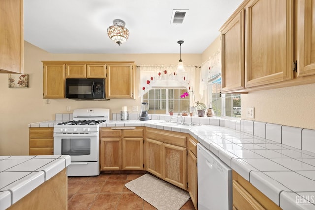 5601 Sugar Pine Dr, Bakersfield, CA 93313 - kitchen featuring white appliances, light brown cabinetry, tile counters, hanging light fixtures, and light tile patterned floors