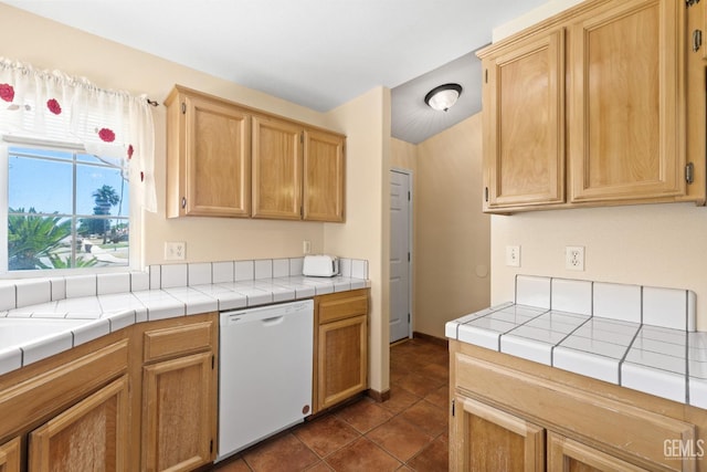 5601 Sugar Pine Dr, Bakersfield, CA 93313 - kitchen with white dishwasher, dark tile patterned floors, and tile counters