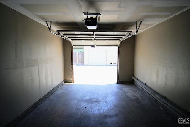 4801 Belle Ter Unit C, Bakersfield, CA 93309 - garage with a garage door opener and baseboards
