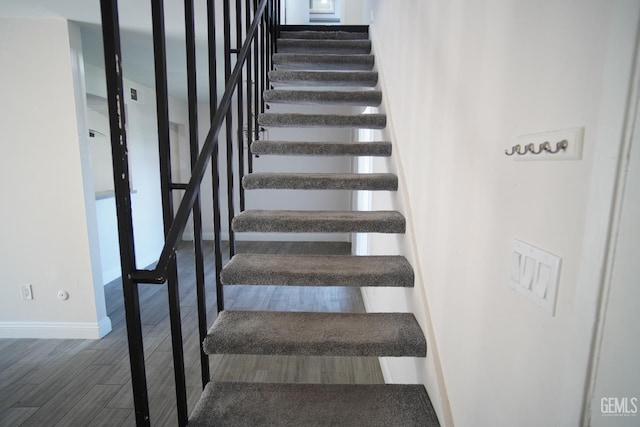 4801 Belle Ter Unit C, Bakersfield, CA 93309 - staircase with baseboards and wood finished floors
