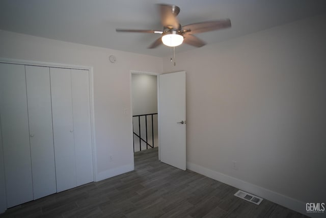 4801 Belle Ter Unit C, Bakersfield, CA 93309 - unfurnished bedroom with dark wood finished floors, a closet, and ceiling fan