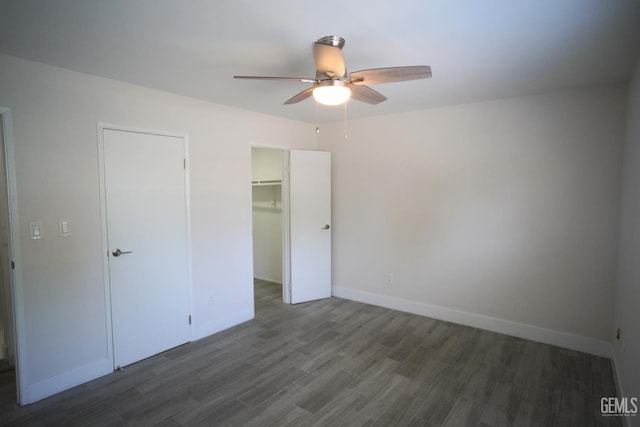 4801 Belle Ter Unit C, Bakersfield, CA 93309 - unfurnished bedroom with dark wood-type flooring, a closet, a spacious closet, and ceiling fan