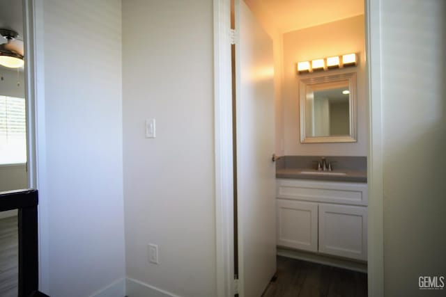 4801 Belle Ter Unit C, Bakersfield, CA 93309 - bathroom featuring vanity and wood finished floors