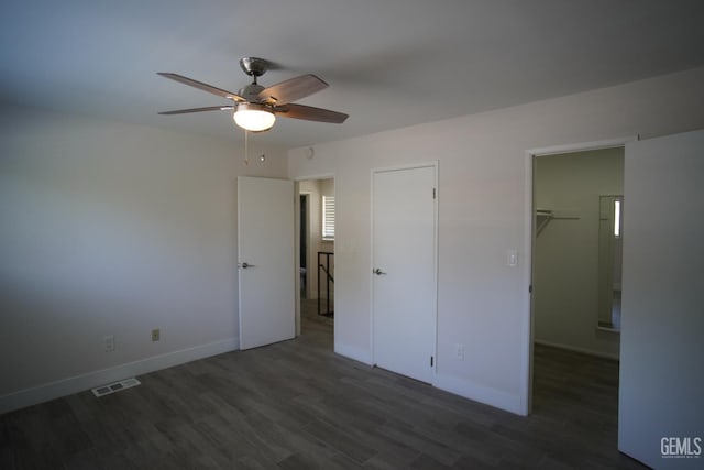 4801 Belle Ter Unit C, Bakersfield, CA 93309 - unfurnished bedroom featuring wood finished floors, a walk in closet, ceiling fan, and a closet