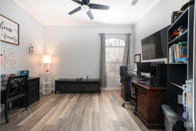 home office featuring ceiling fan and light hardwood / wood-style floors